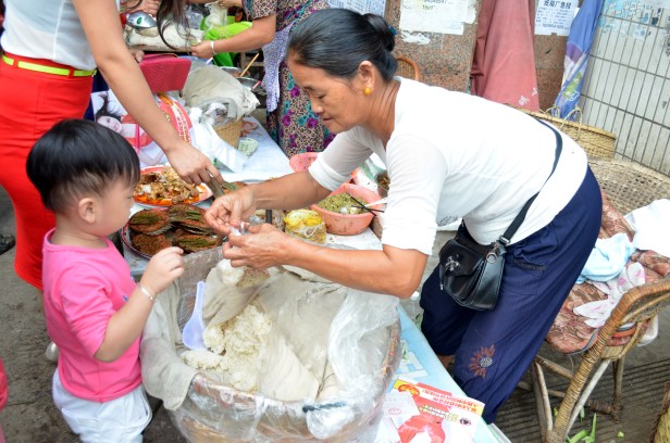 House of Haos Xishuangbanna Menghai Aini Village Market Child Buying Sticky Rice 1